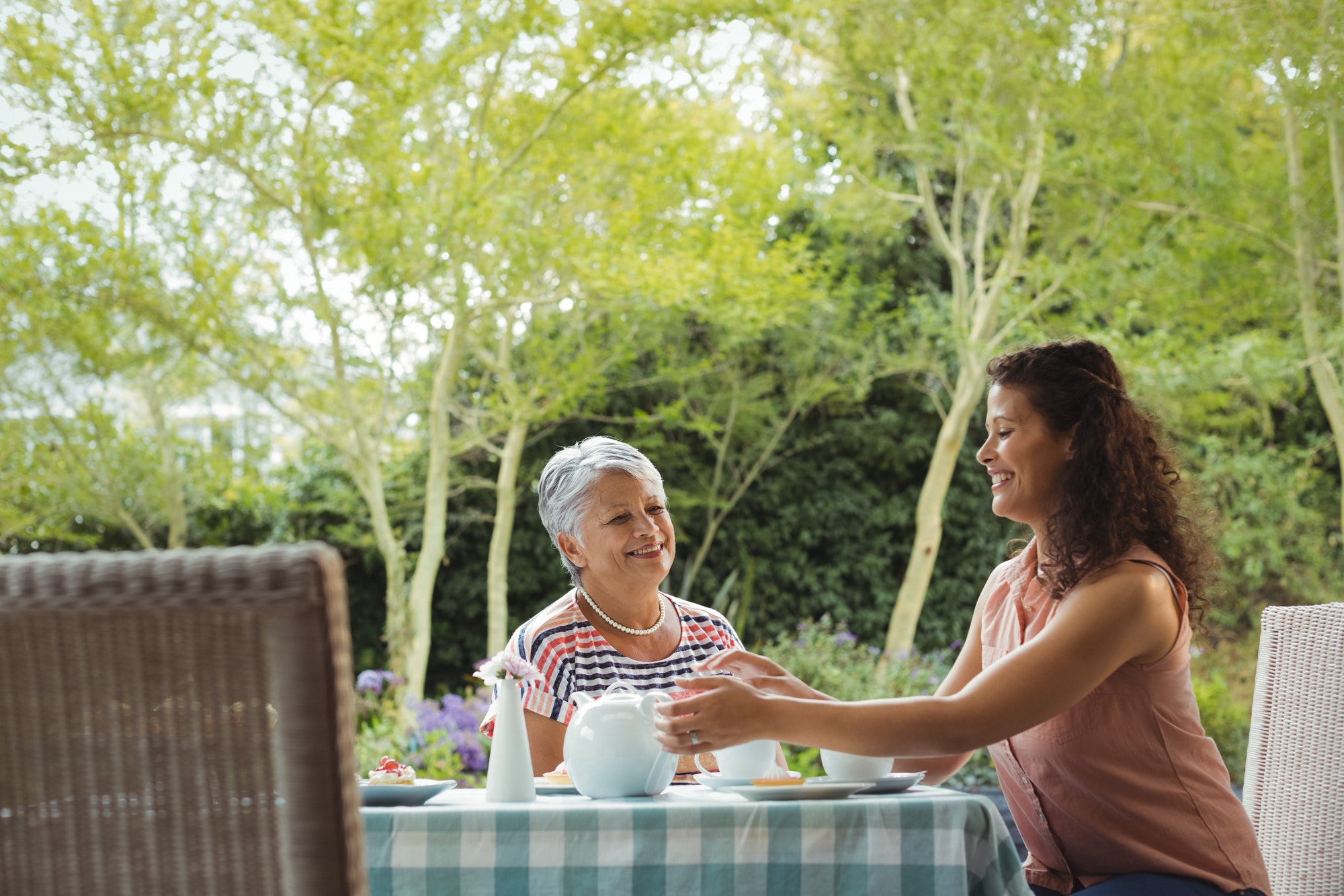 Mother and daughter having tea